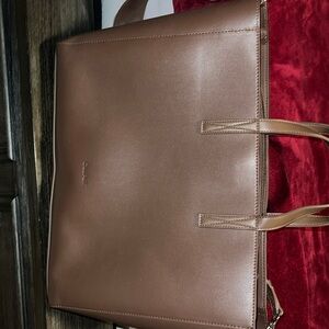 Calpak haven tote with crossbody strap.